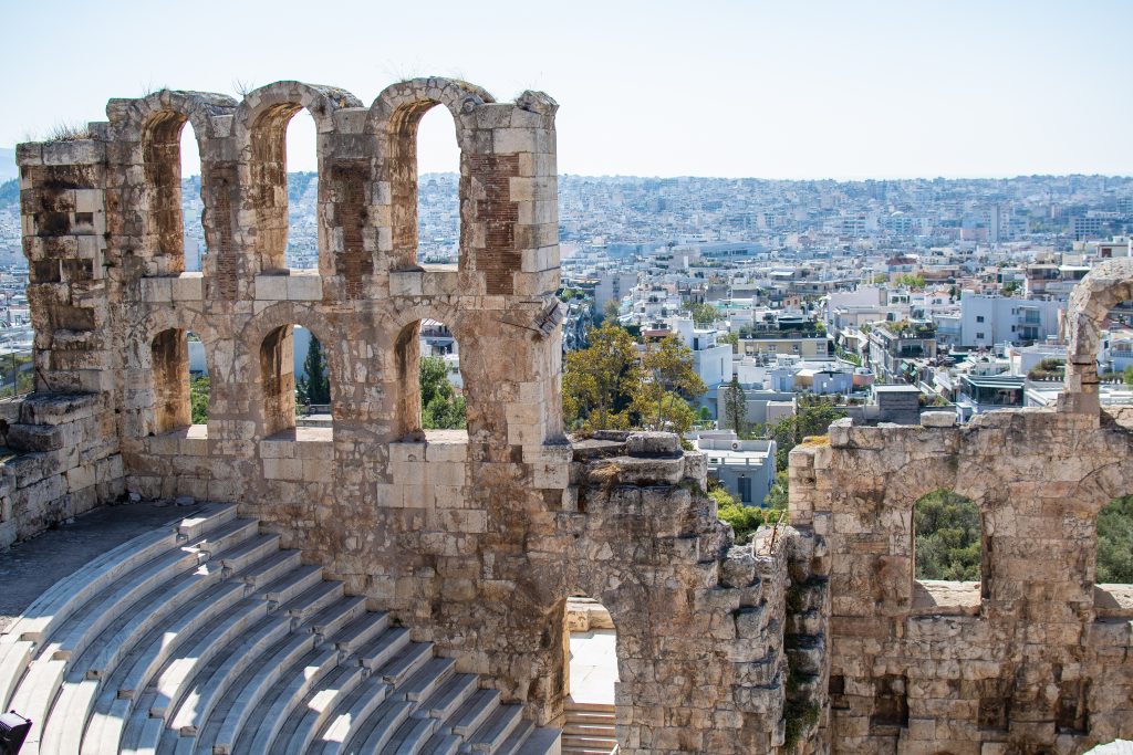 Odeon of Herodes Atticus with view of the city of athens inside of the acropolis