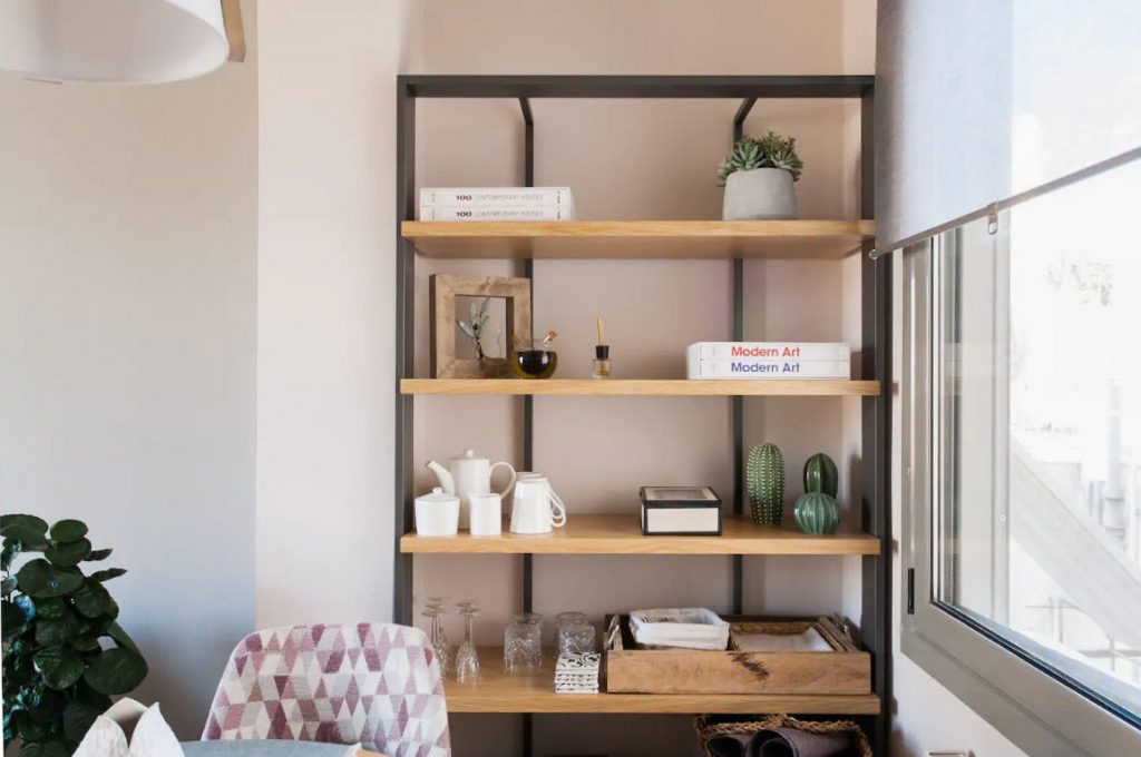 shelving and styling decor in dining room inside cute airbnb in The Cutest Airbnb Vacation Rental In Athens, Greece