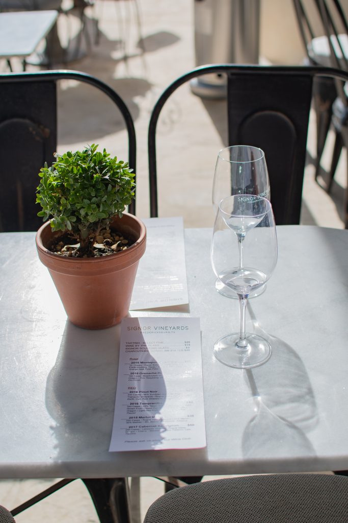 wine tasting setup on outdoor patio at signor vineyards in fredericksburg texas