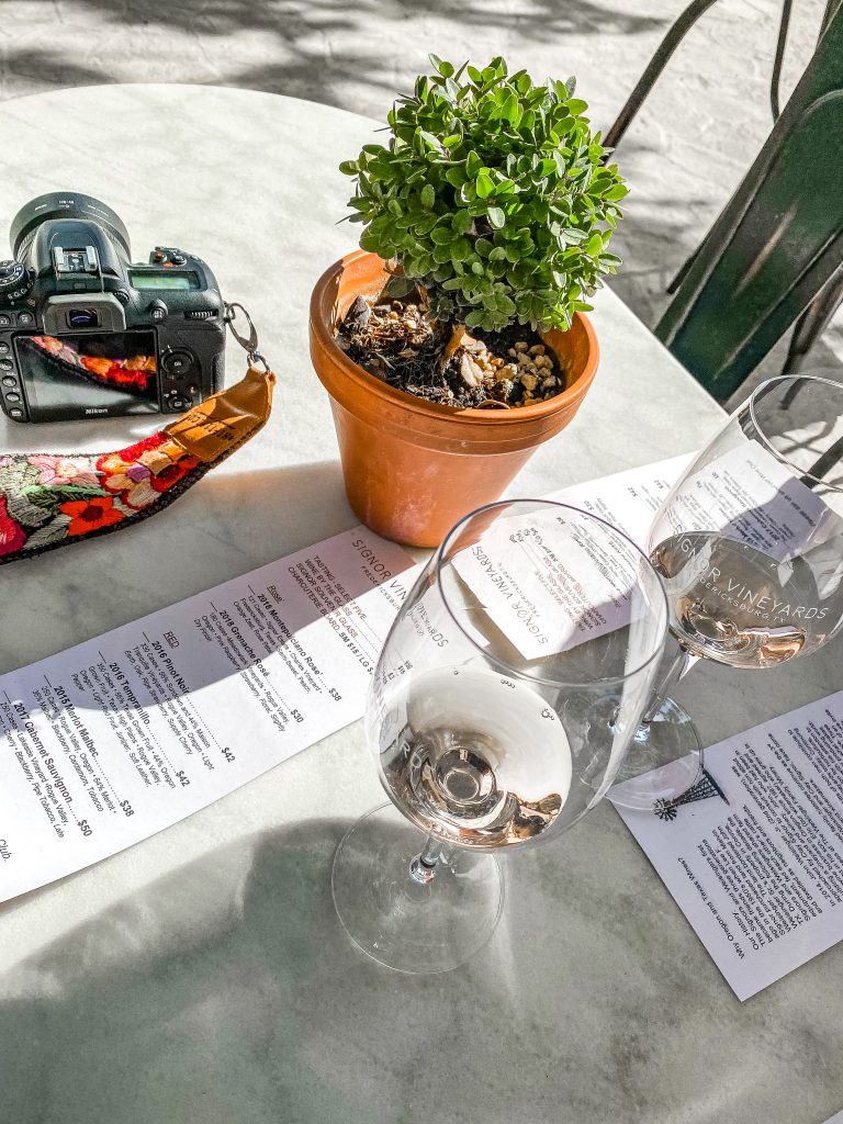 wine tasting setup on outdoor patio at signor vineyards in fredericksburg texas