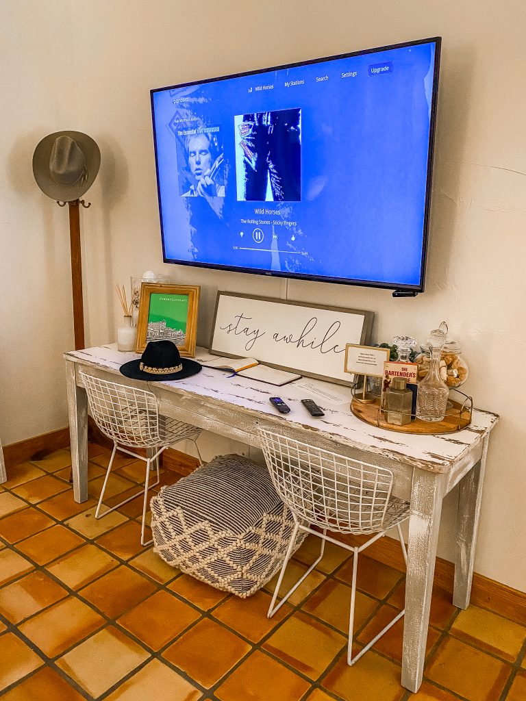 smart tv and console table in emma haus fredericksburg tx charming airbnb home rental