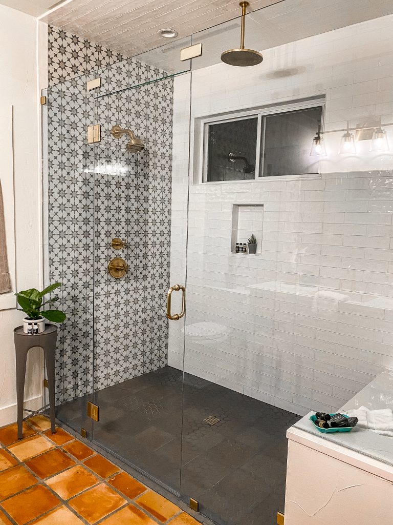 luxury bathroom in emma haus fredericksburg airbnb rental with marble/quartz countertops, gold faucets and luxury amenities, newly renovated bathroom in cute texas hill country cottage, modern bathroom, 2 person shower