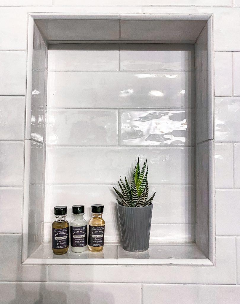 bathroom accessories and succulent decor in newly renovated modern luxury bathroom in emma haus fredericksburg texas airbnb vacation rental