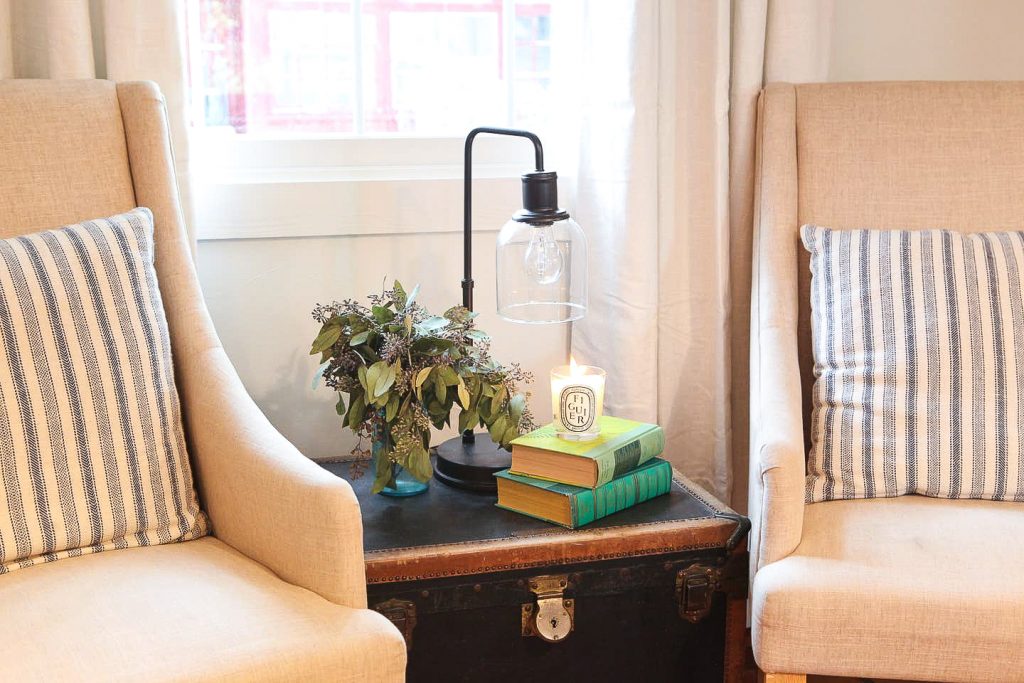 pair of chairs and side table in kitchen of charming airbnb rental emma haus fredericksburg in texas