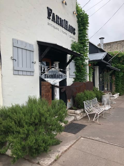 farmhaus antiques fredericksburg texas, antique shop in fredericksburg texas, exterior of farmhaus antiques in fredericksburg tx, best shops in fredericksburg