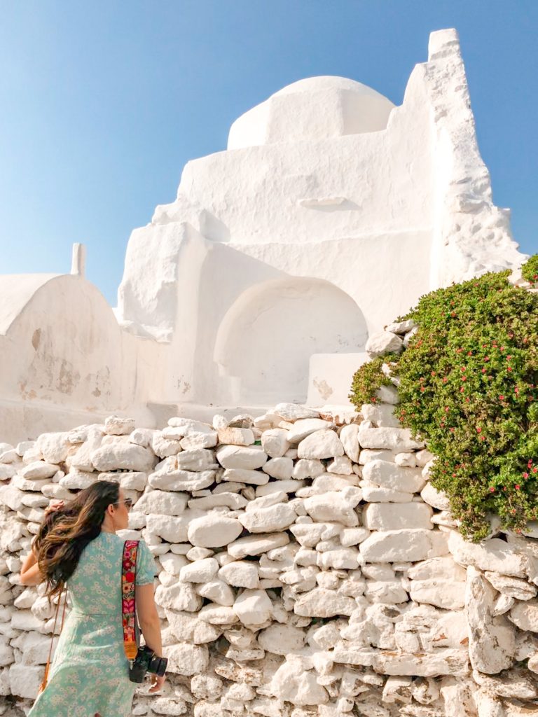 best things to do in mykonos, girl with camera sightseeing in mykonos