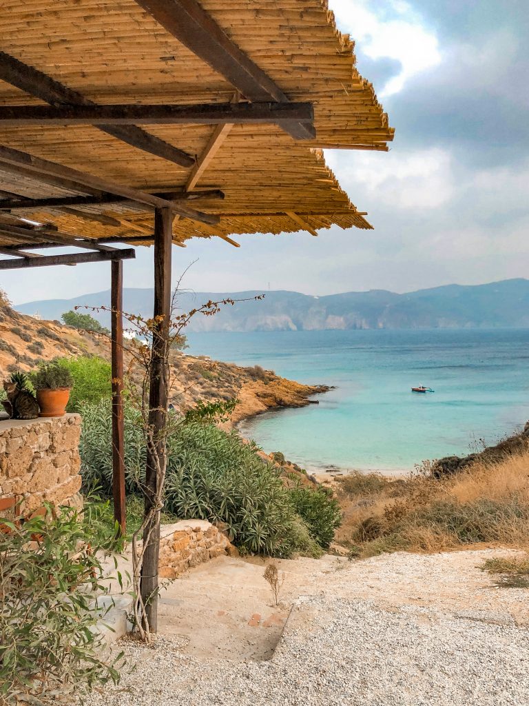 kiki's tavern mykonos, kiki's tavern restaurant agios sostis beach, best restaurants in mykonos, best things to do in mykonos, local cuisine mykonos, view of beach shack looking over agios sostis beach