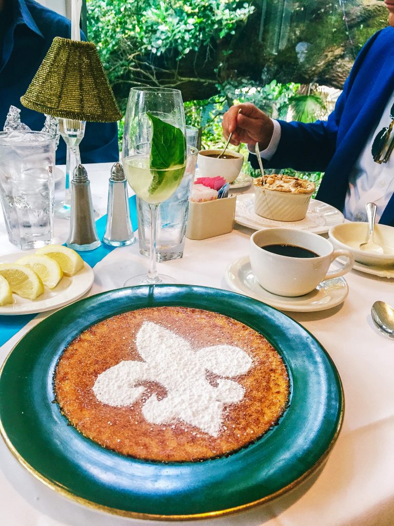 Jazz brunch at Commander's Palace in the garden room overlooking the garden courtyard with fleur-de-lis creme brulee dessert